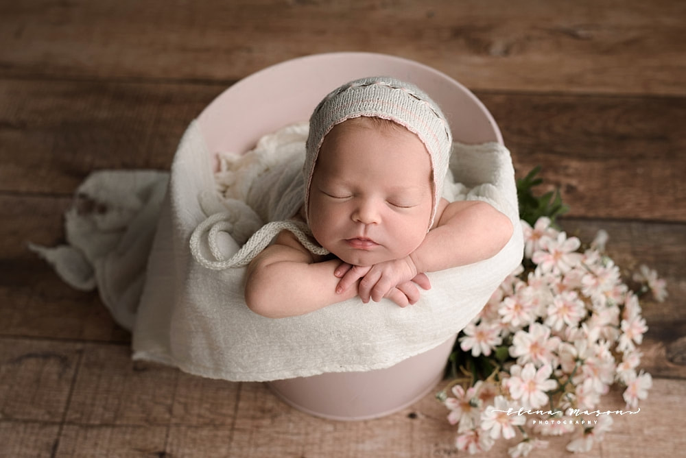 newborn baby girl in bucket with flowers, Belfast baby photographer, Elena Mason Photography