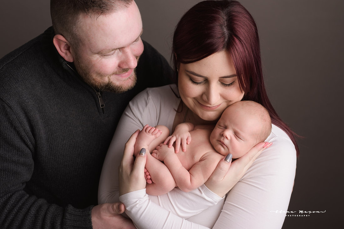 sleeping baby in parents hands, newborn photo session, newborn photography Belfast