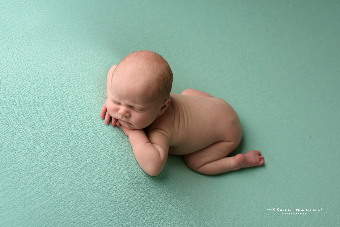 sleeping baby on green, newborn photo session, newborn photography Belfast