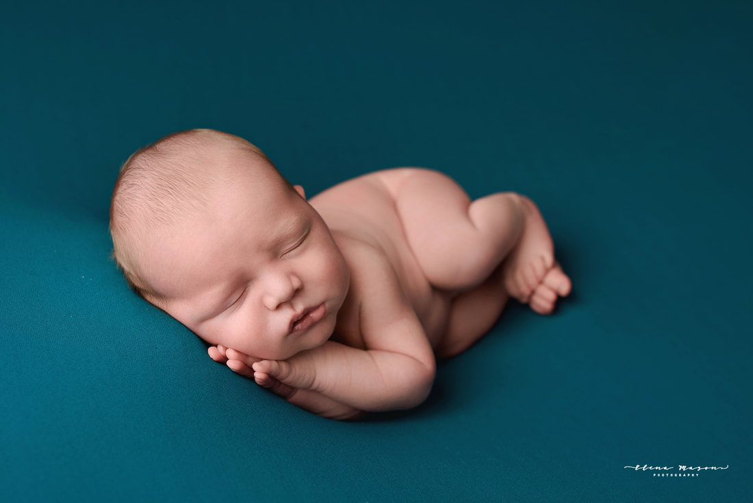 newborn baby in blue wrapped, newborn photo session Belfast