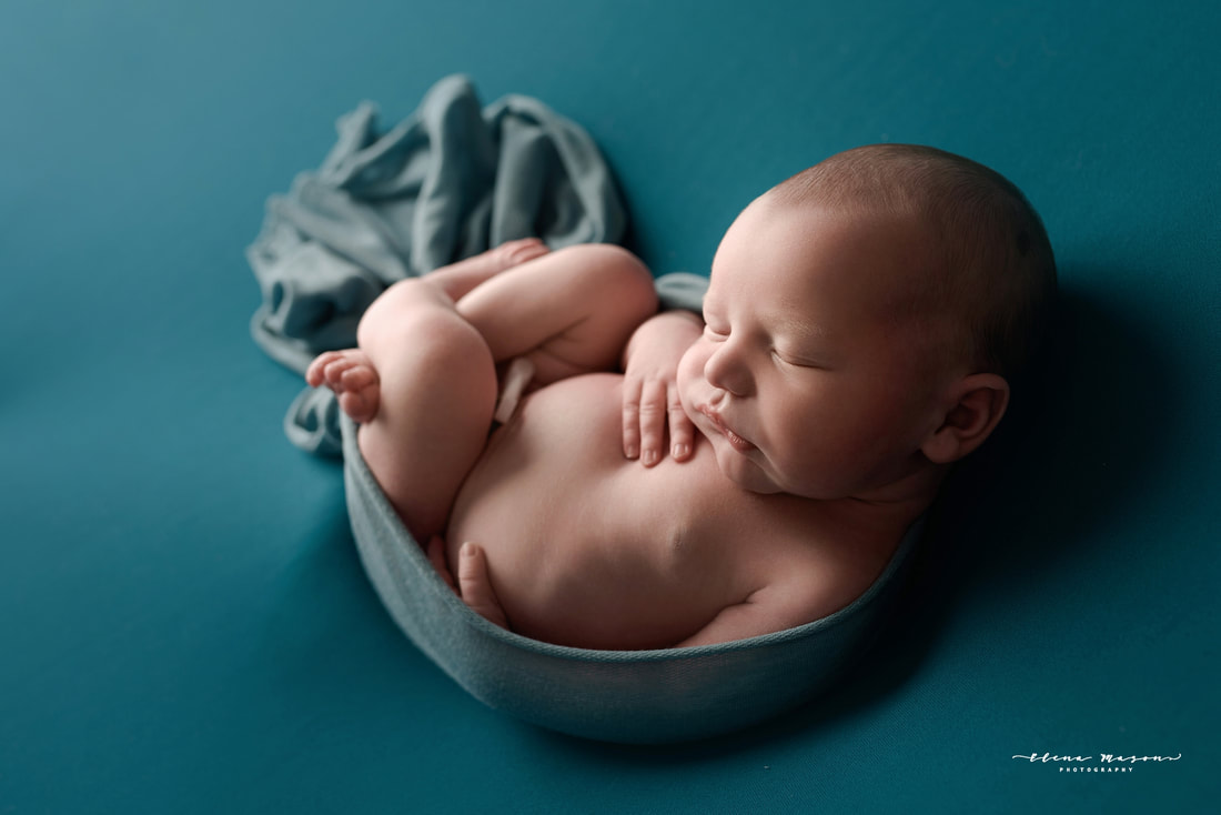 newborn baby in blue wrapped, newborn photo session Belfast